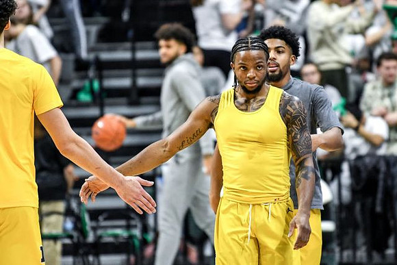 Brandon Johns Jr. (23), Zavier Simpson (3), and David DeJulius (0)