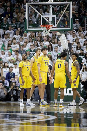 Zavier Simpson (3), Franz Wagner (21), Brandon Johns Jr. (23), David DeJulius (0), and Eli Brooks (55)