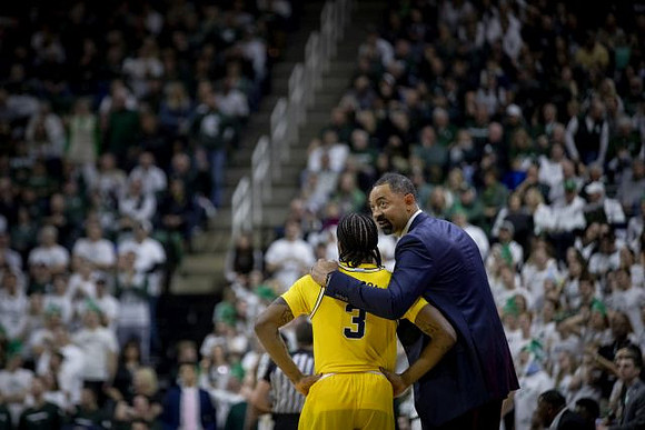 Zavier Simpson (3) and Juwan Howard
