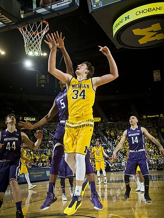 Zak Irvin (21), Mark Donnal (34), and Muhammad-Ali Abdur-Rahkman (12)