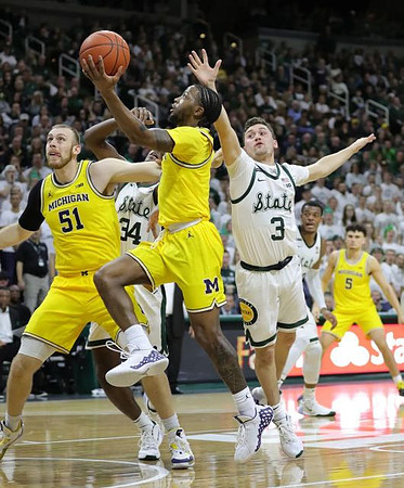 Austin Davis (51), Zavier Simpson (3), and Adrien Nunez (5)