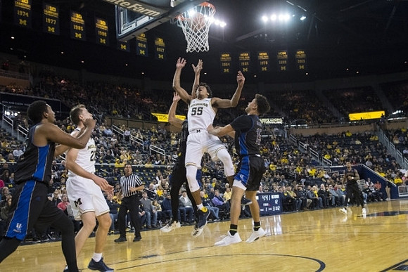 Duncan Robinson (22) and Eli Brooks (55)