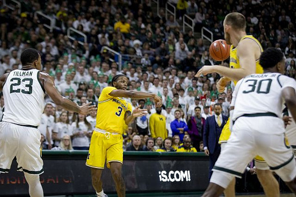 Zavier Simpson (3) and Austin Davis (51)