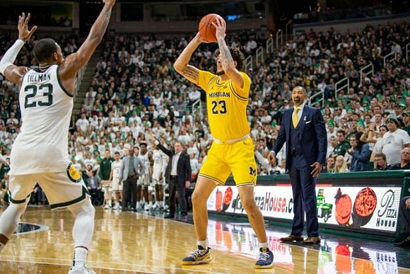 Brandon Johns Jr. (23) and Juwan Howard