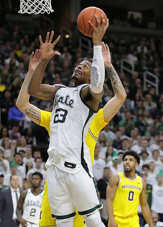 Brandon Johns Jr. (23) and David DeJulius (0)