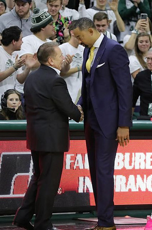 Michigan State Head Coach Tom Izzo and Juwan Howard