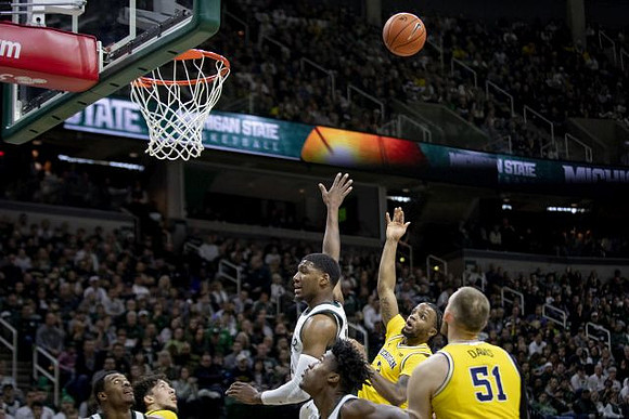Brandon Johns Jr. (23), Zavier Simpson (3), and Austin Davis (51)