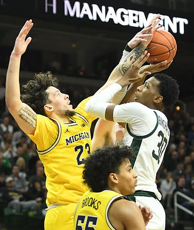 Brandon Johns Jr. (23) and Eli Brooks (55)