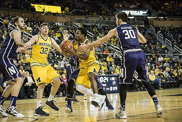 Ricky Doyle (32) and Derrick Walton Jr. (10)