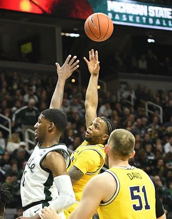Zavier Simpson (3) and Austin Davis (51)