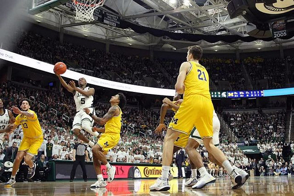 Brandon Johns Jr. (23), Eli Brooks (55), and Franz Wagner (21)