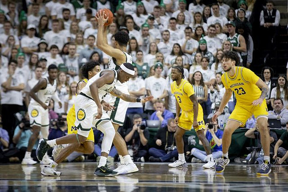 Eli Brooks (55), Zavier Simpson (3), and Brandon Johns Jr. (23)