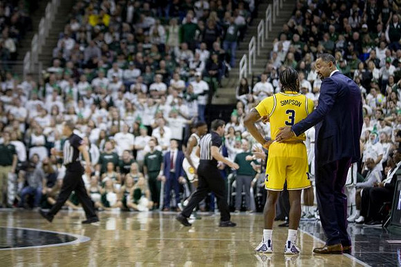 Zavier Simpson (3) and Juwan Howard