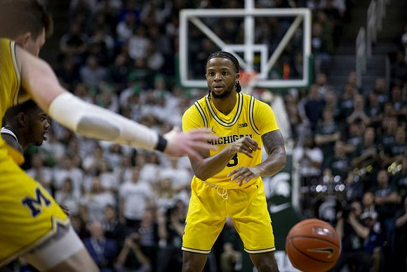 Jon Teske (15) and Zavier Simpson (3)