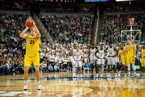 Franz Wagner (21), Zavier Simpson (3), Colin Castleton (11), and David DeJulius (0)