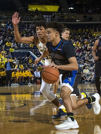 Eli Brooks (55) and Duncan Robinson (22)