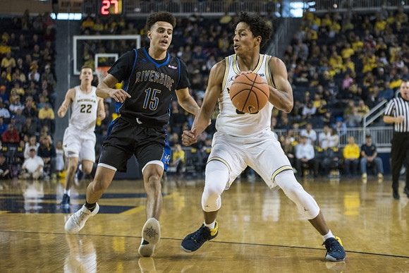 Duncan Robinson (22) and Eli Brooks (55)