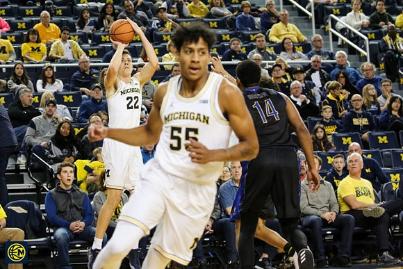 Duncan Robinson (22) and Eli Brooks (55)