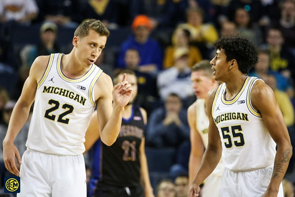 Duncan Robinson (22) and Eli Brooks (55)