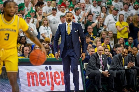 Zavier Simpson (3), Juwan Howard, Phil Martelli, Saddi Washington, and Howard Eisley