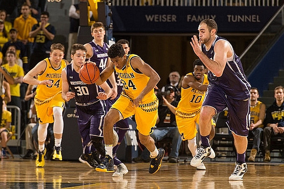 Mark Donnal (34), Aubrey Dawkins (24), and Derrick Walton Jr. (10)