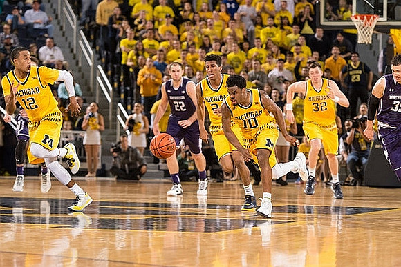 Muhammad-Ali Abdur-Rahkman (12), Aubrey Dawkins (24), Derrick Walton Jr. (10), and Ricky Doyle (32)