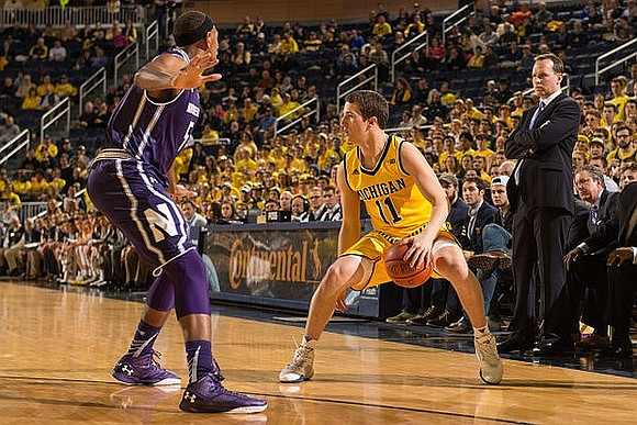 Andrew Dakich (11) and Northwestern Head Coach Chris Collins