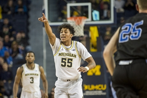 Zavier Simpson (3) and Eli Brooks (55)