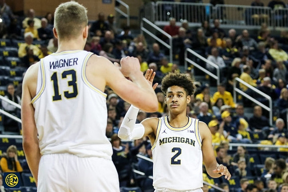 Moritz Wagner (13) and Jordan Poole (2)
