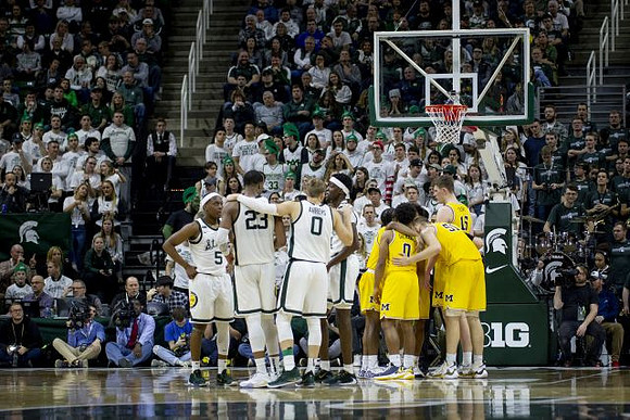 Zavier Simpson (3), David DeJulius (0), Austin Davis (51), and Jon Teske (15)