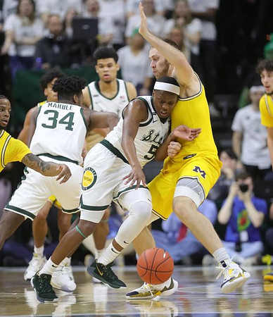 Zavier Simpson (3), Austin Davis (51), and Brandon Johns Jr. (23)