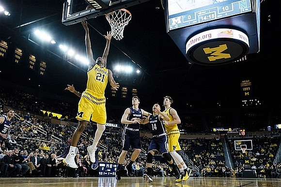 Zak Irvin (21) and Mark Donnal (34)