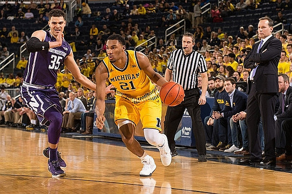 Zak Irvin (21) and Northwestern Head Coach Chris Collins