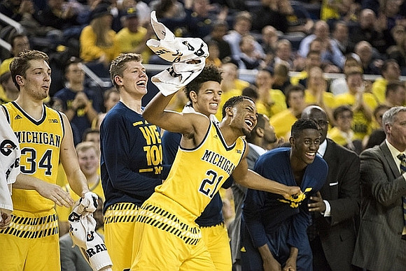 Mark Donnal (34), Moritz Wagner (13), D.J. Wilson (5), Zak Irvin (21), and Caris LeVert (23)