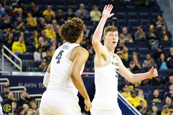 Isaiah Livers (4) and Jon Teske (15)