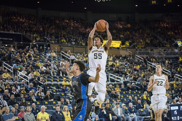 Eli Brooks (55) and Duncan Robinson (22)