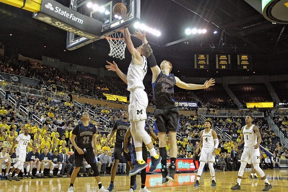 Muhammad-Ali Abdur-Rahkman (12), Moritz Wagner (13), Isaiah Livers (4), and Charles Matthews (1)