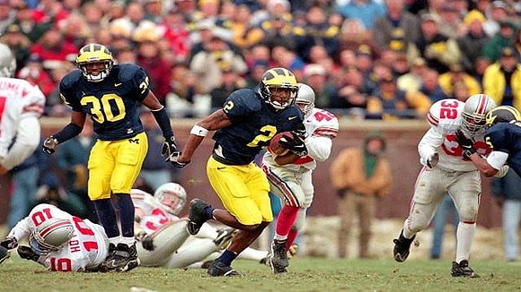 Charles Woodson (2), Andre Weathers (30), and James Whitley (5)