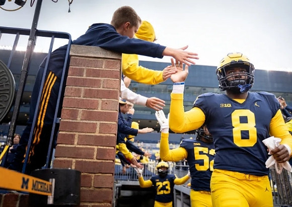 Derrick Moore (8), Kechaun Bennett (52), and Michael Barrett (23)