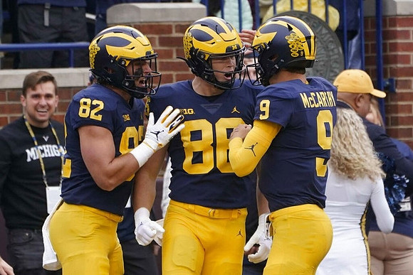 Max Bredeson (82), Luke Schoonmaker (86), and J.J. McCarthy (9)