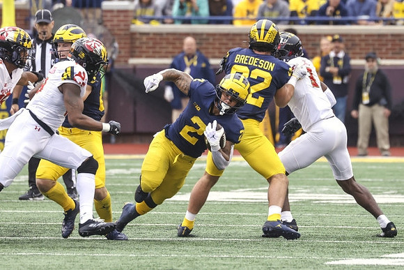 Blake Corum (2) and Max Bredeson (82)