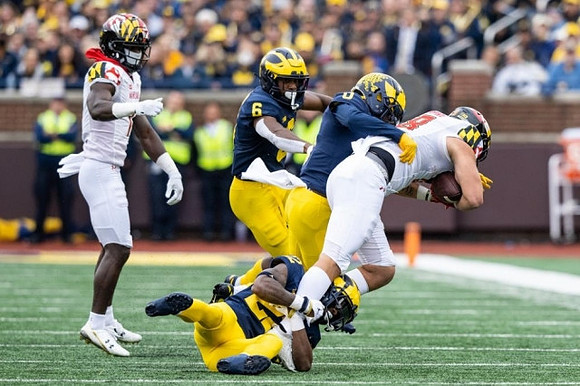 R.J. Moten (6), Mike Sainristil (0), and Gemon Green (22)