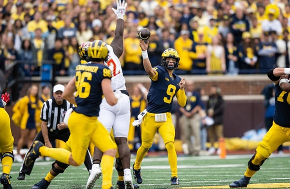Luke Schoonmaker (86) and J.J. McCarthy (9)