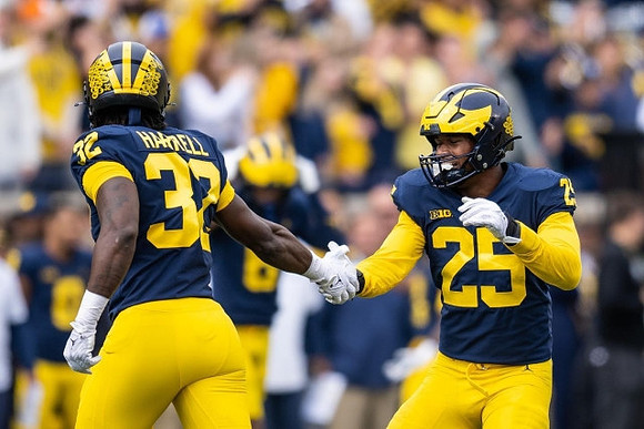 Jaylen Harrell (32) and Junior Colson (25)