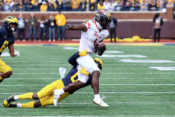 R.J. Moten (6) and Mike Sainristil (0)