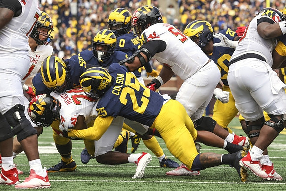 Junior Colson (25), Mazi Smith (58), Mike Sainristil (0), and Kalel Mullings (20)