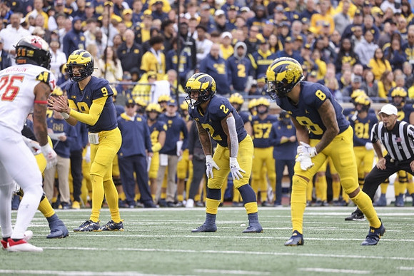 J.J. McCarthy (9), Blake Corum (2), and Ronnie Bell (8)