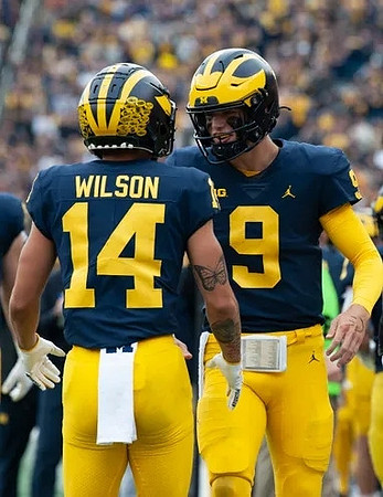Roman Wilson (14) and J.J. McCarthy (9)