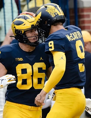 Luke Schoonmaker (86) and J.J. McCarthy (9)