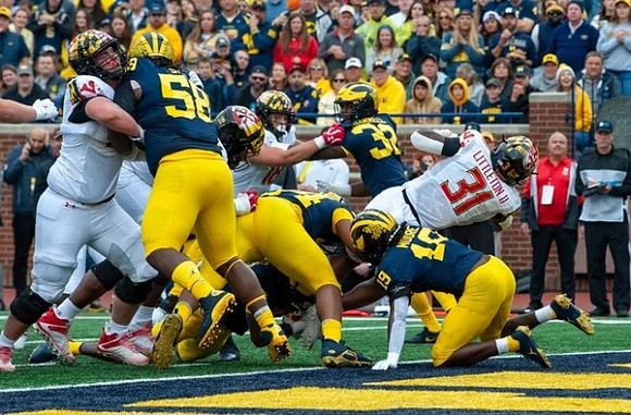 Mazi Smith (58), Rod Moore (19), and Jaylen Harrell (32)